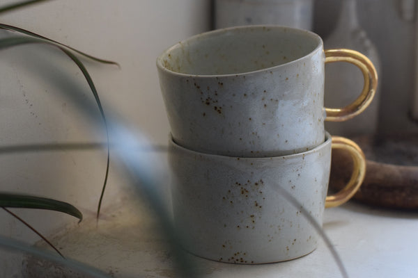 Organic white cylinder mug w/ gold handle