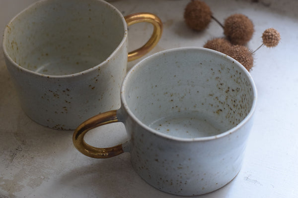 Organic white cylinder mug w/ gold handle