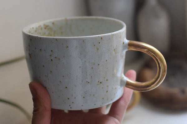 Organic white cylinder mug w/ gold handle